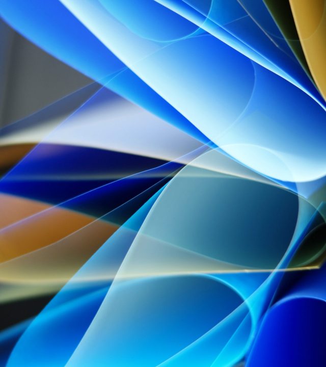 Vibrant abstract artwork featuring flowing blue and gold hues with dynamic shapes and gradients.
